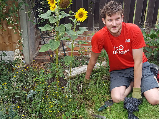 Saving the flowers and giving the weeds a good forking to!