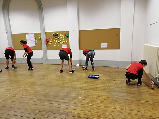 Shiny happy people varnishing floors