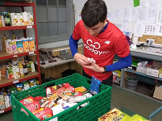 Help to sort essential food donations or drop off donations of your own