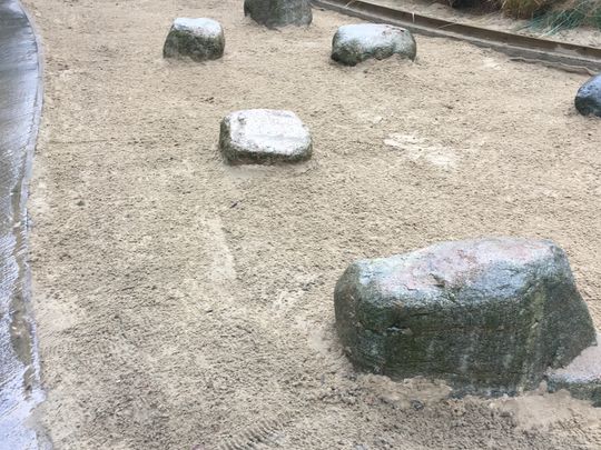 Practising Reiki in the sand pit.