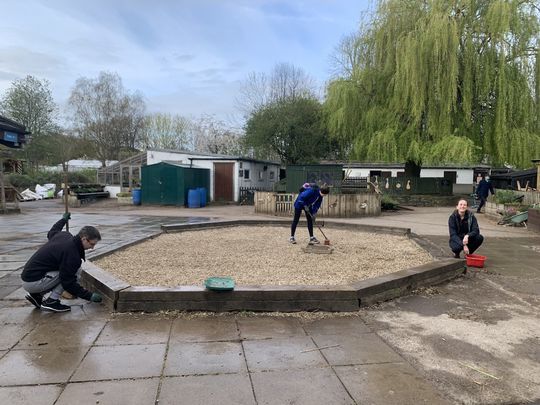 Returning the stones to where they belong and sweeping the hay away on a Friday morning