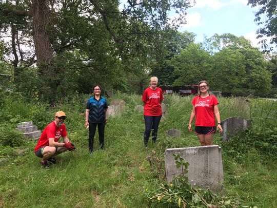 Clearing historical headstones for school project