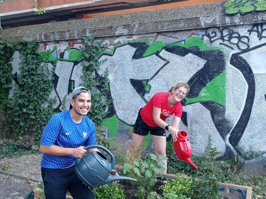 Wheelbarrowing and watering at Cossall Estate 