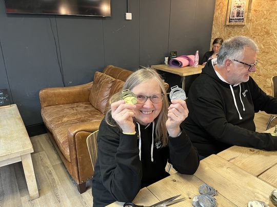 Medal fatigue causes Barbara to pose for photo 